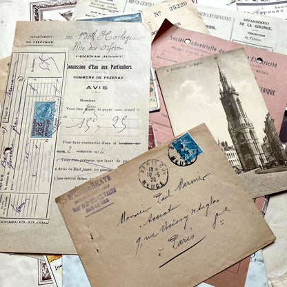 1920s French Ephemera Lot with various documents, vintage postcards, sheet music, period photos, and a stock certificate.