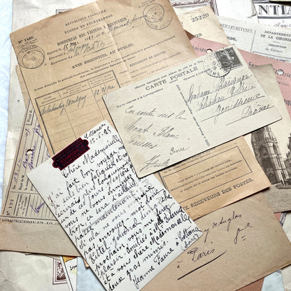 1920s French Ephemera Lot with various documents, vintage postcards, sheet music, period photos, and a stock certificate.