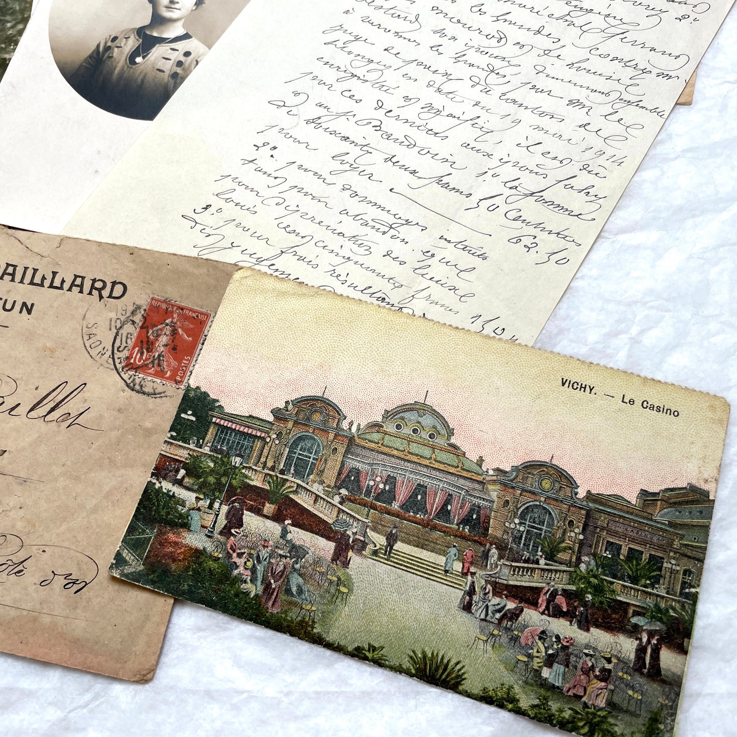 Mixed French Ephemera Lot, 1910s. Vintage postcards, handwritten letters, photos, and historical French documents.