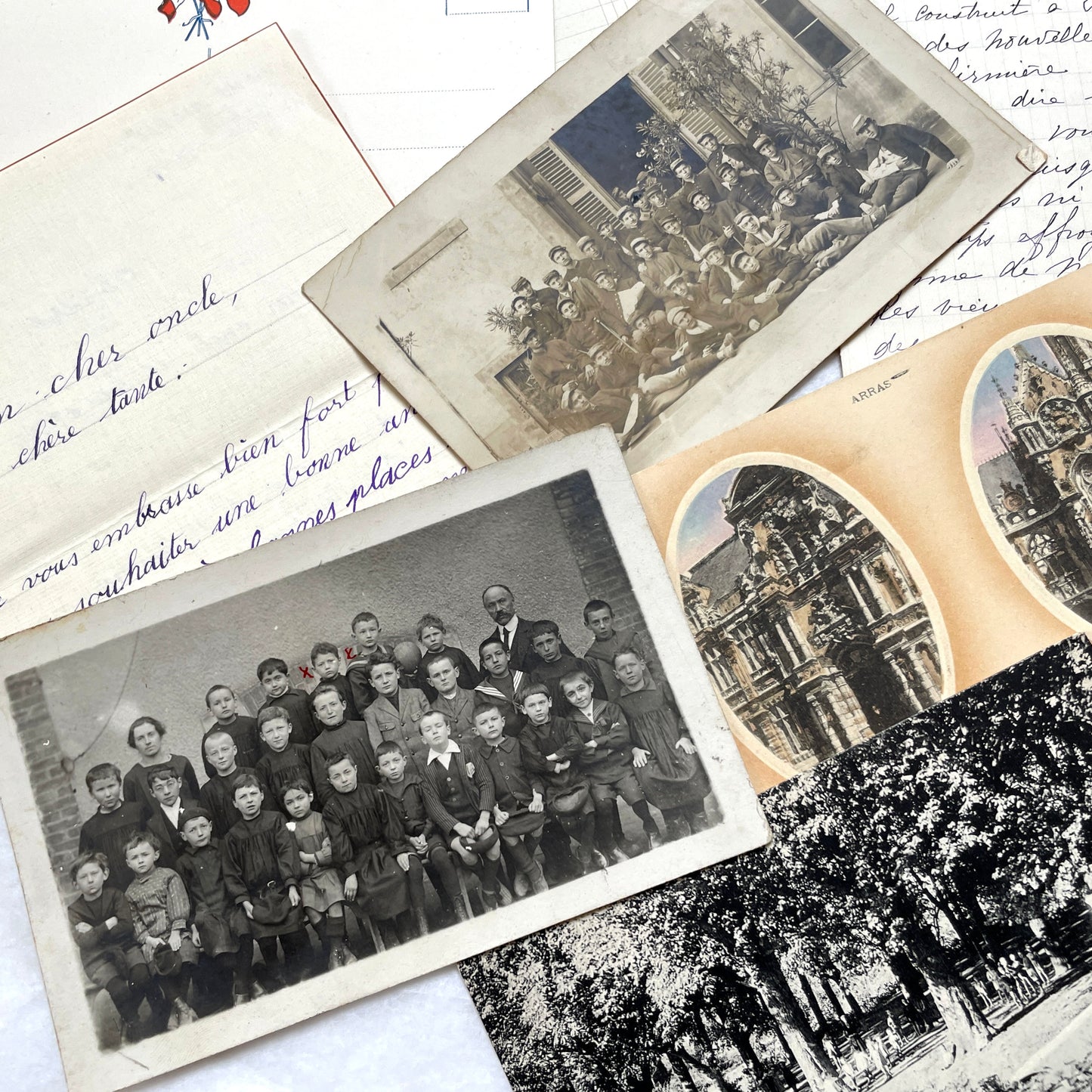 Mixed French Ephemera Lot, 1910s. Vintage postcards, handwritten letters, photos, and historical French documents.