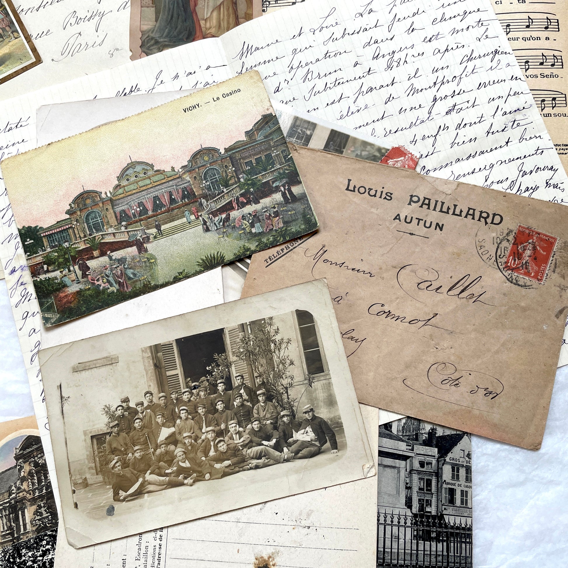 Mixed French Ephemera Lot, 1910s. Vintage postcards, handwritten letters, photos, and historical French documents.