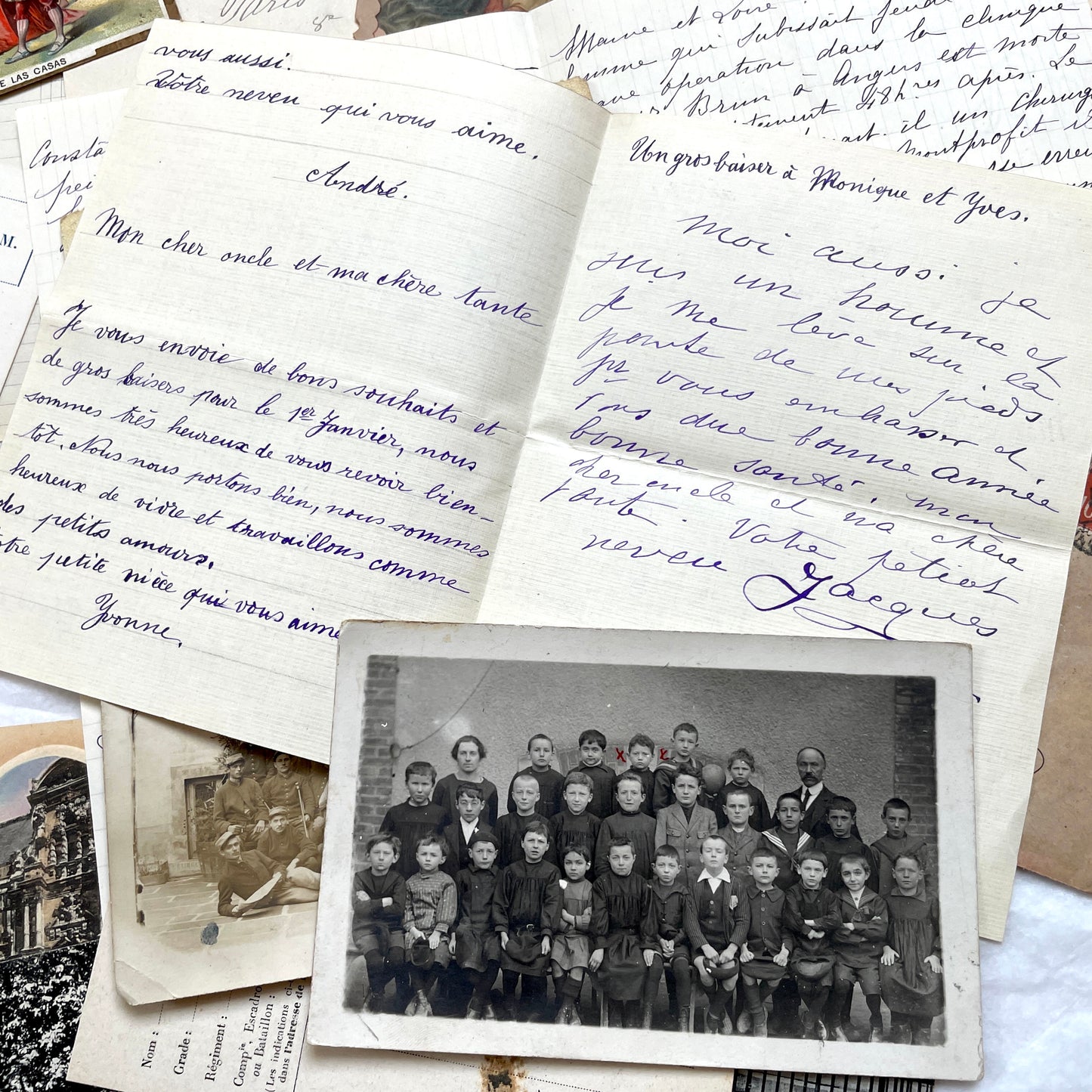 Mixed French Ephemera Lot, 1910s. Vintage postcards, handwritten letters, photos, and historical French documents.