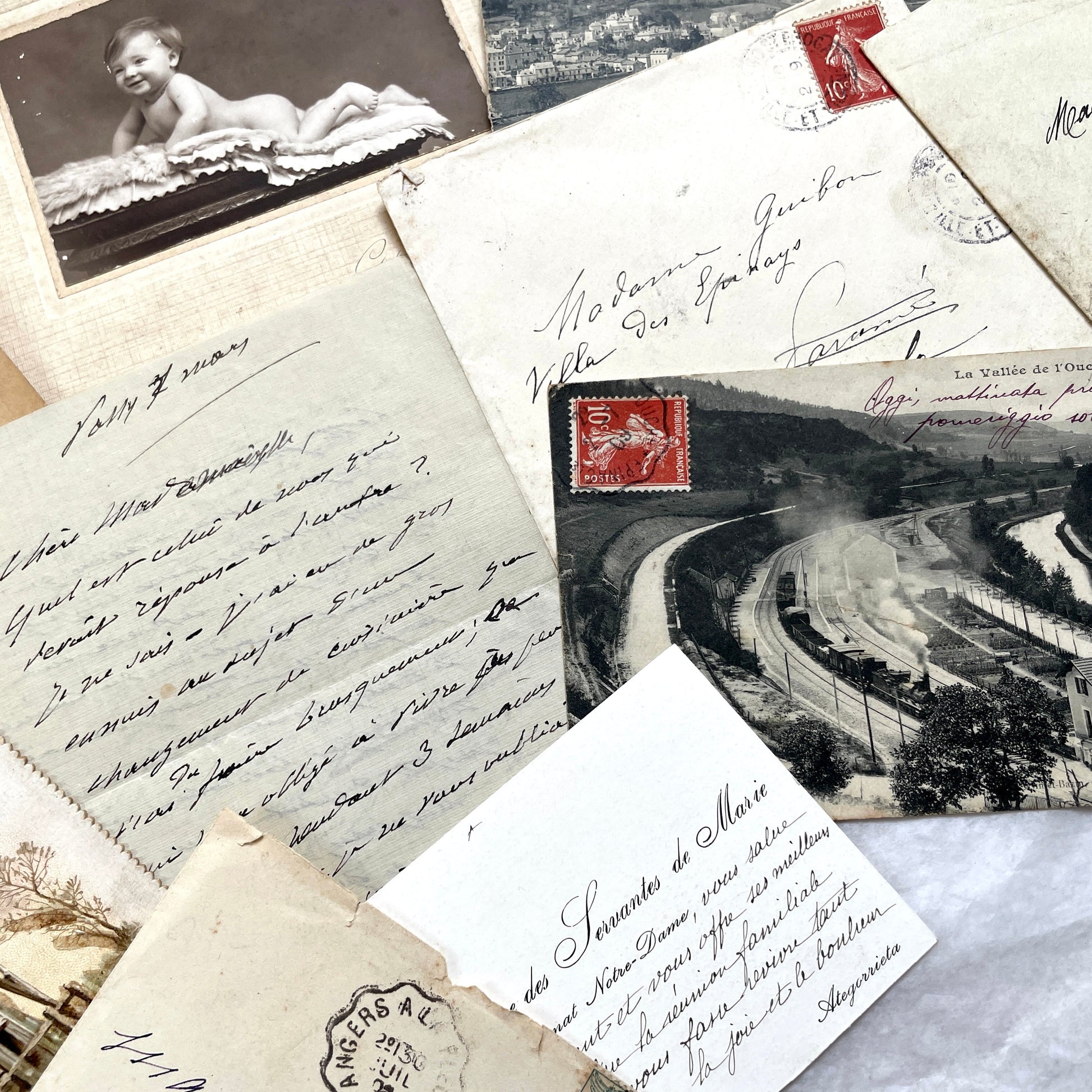 1910s Vintage French Ephemera Lot featuring handwritten letters, postcards, baby photo, and old documents.