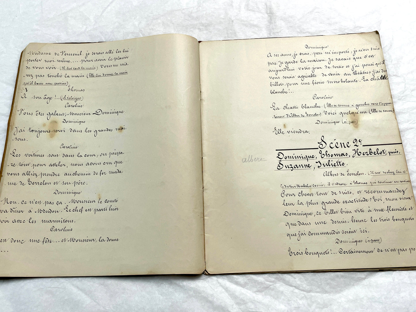 Late 19th French handwritten play manuscript with 'Scène 5' and 'Personnages' list visible.