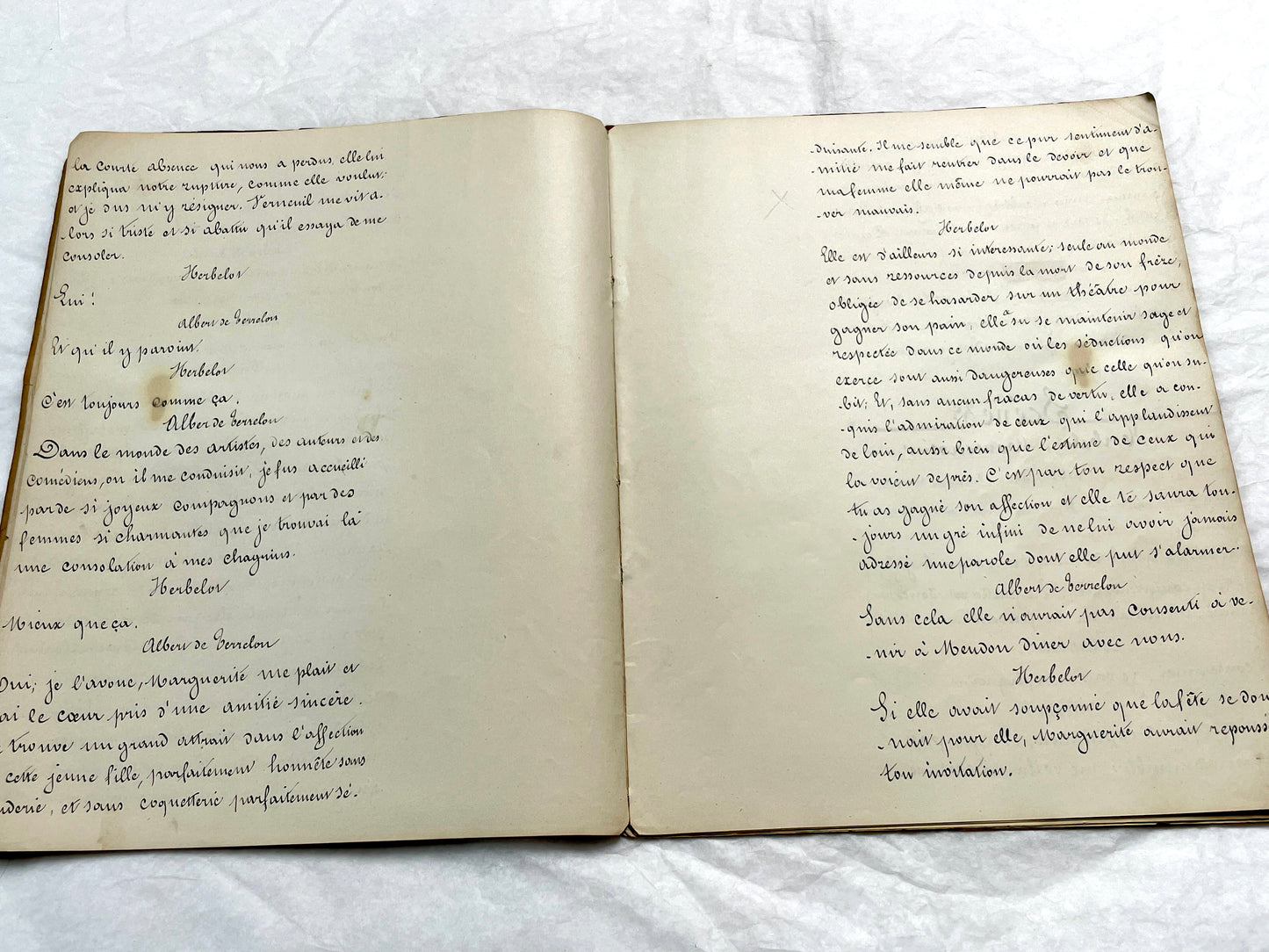 Late 19th French handwritten play manuscript with 'Scène 5' and 'Personnages' list visible.