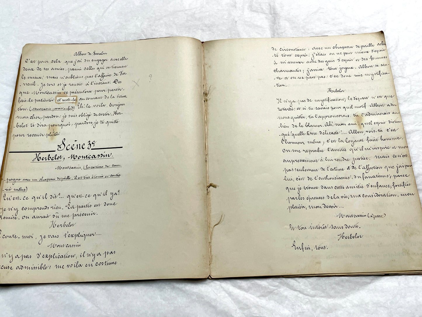 Late 19th French handwritten play manuscript with 'Scène 5' and 'Personnages' list visible.