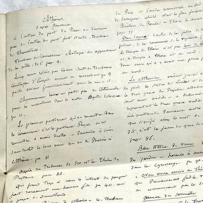 1900s French handwritten manuscript pages detailing ancient Greece history and mythology with elegant script.