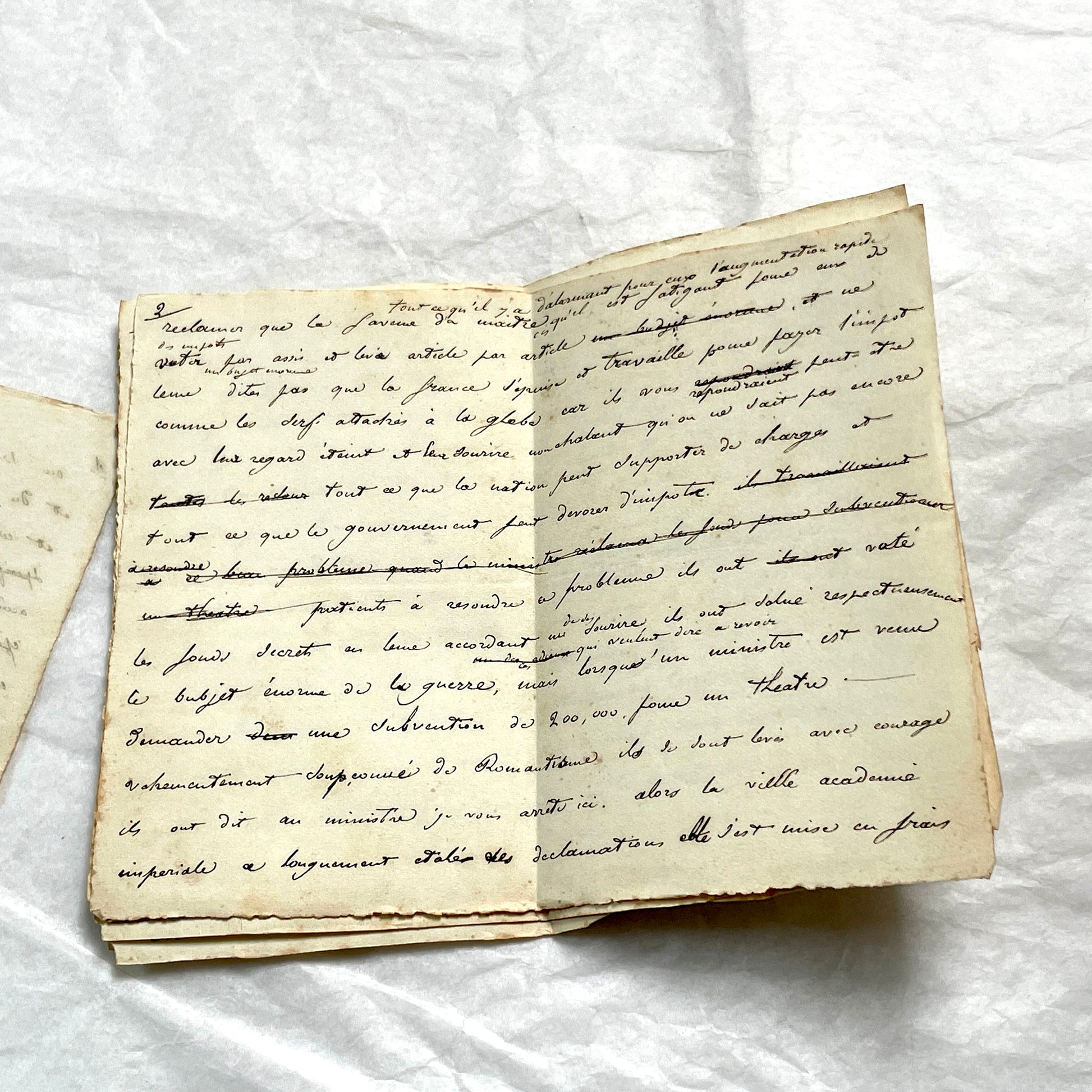 Late 19th French manuscript pages with elegant handwritten script detailing a historical political discourse.