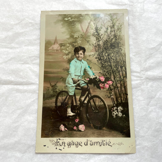 1900s French Postcard Lot featuring charming children on a bicycle, holding flowers, and in an antique car.