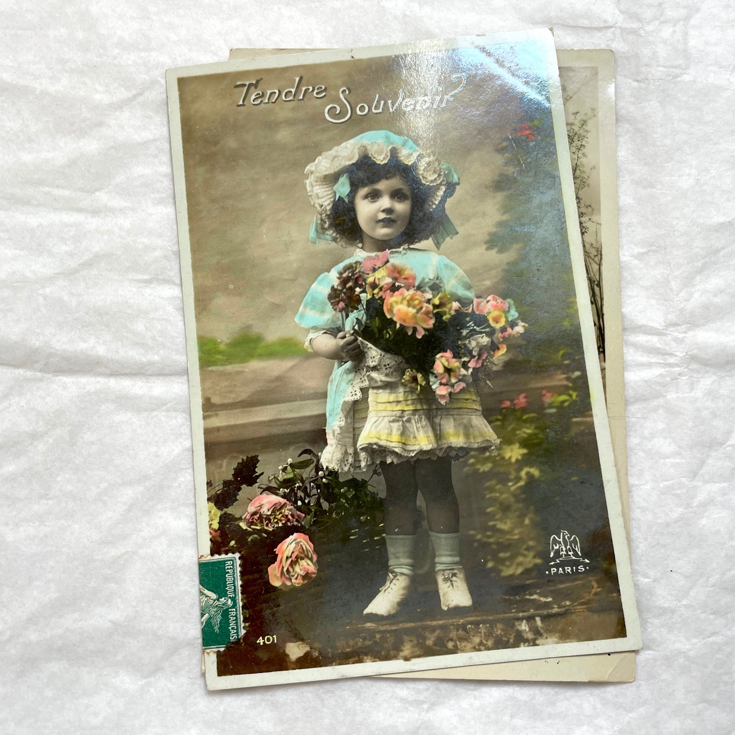 1900s French Postcard Lot featuring charming children on a bicycle, holding flowers, and in an antique car.