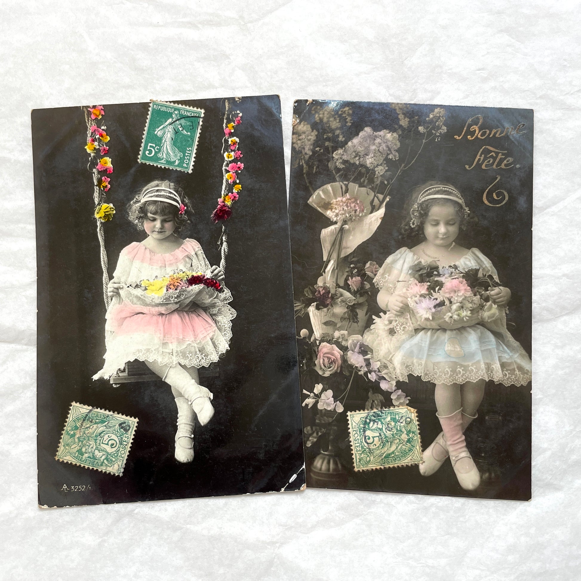 1900s French postcards lot featuring two sweet little girls with flowers, hand-colored details, and vintage stamps.