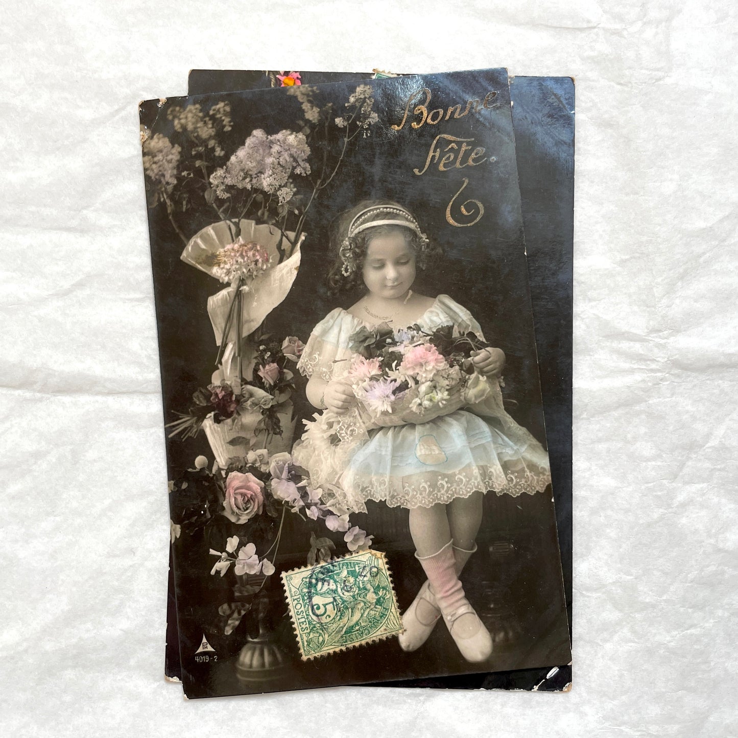 1900s French postcards lot featuring two sweet little girls with flowers, hand-colored details, and vintage stamps.