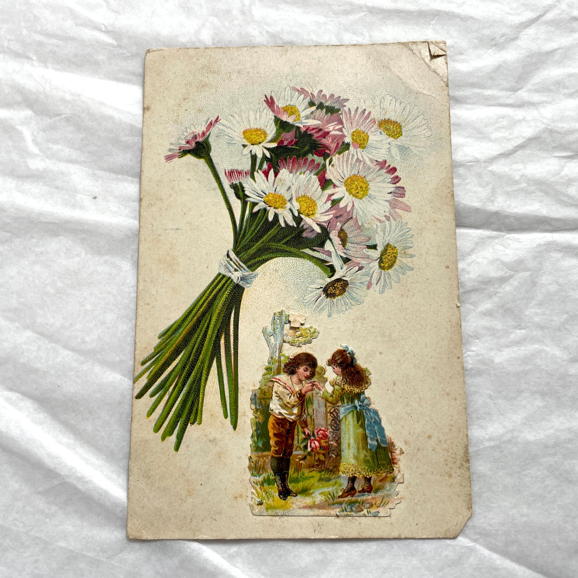1900s lot of three antique French postcards featuring children, daisies, pansies, and lily of the valley.
