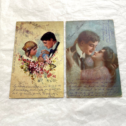 Two 1910s vintage French postcards featuring romantic couples with flowers and New Year greetings.
