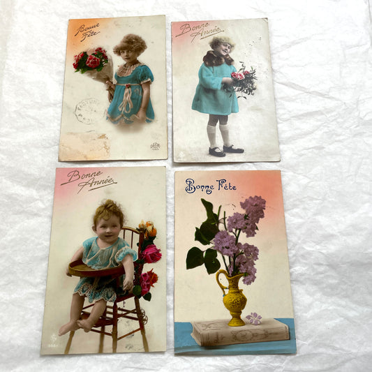 1910s French postcards lot featuring vintage children and floral designs with 'Bonne Fête' and 'Bonne Année' greetings.