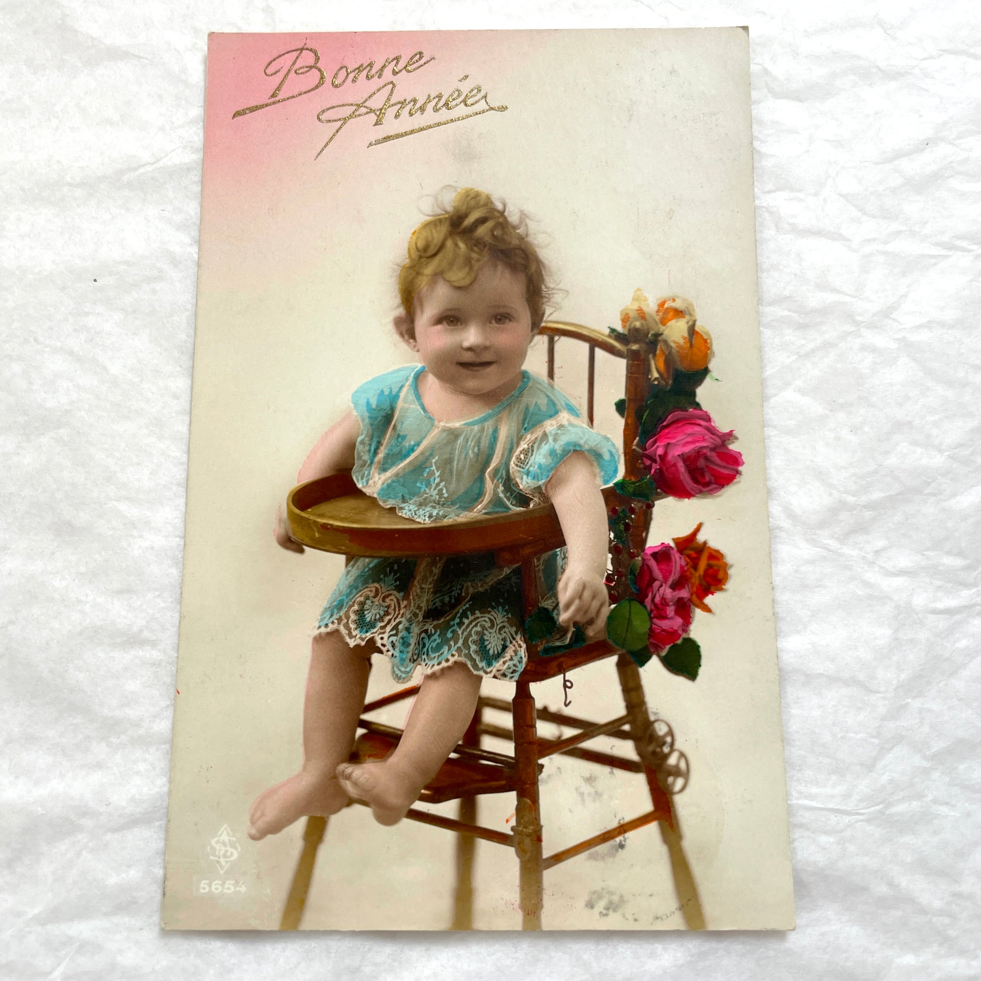 1910s French postcards lot featuring vintage children and floral designs with 'Bonne Fête' and 'Bonne Année' greetings.