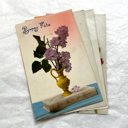 1910s French postcards lot featuring vintage children and floral designs with 'Bonne Fête' and 'Bonne Année' greetings.