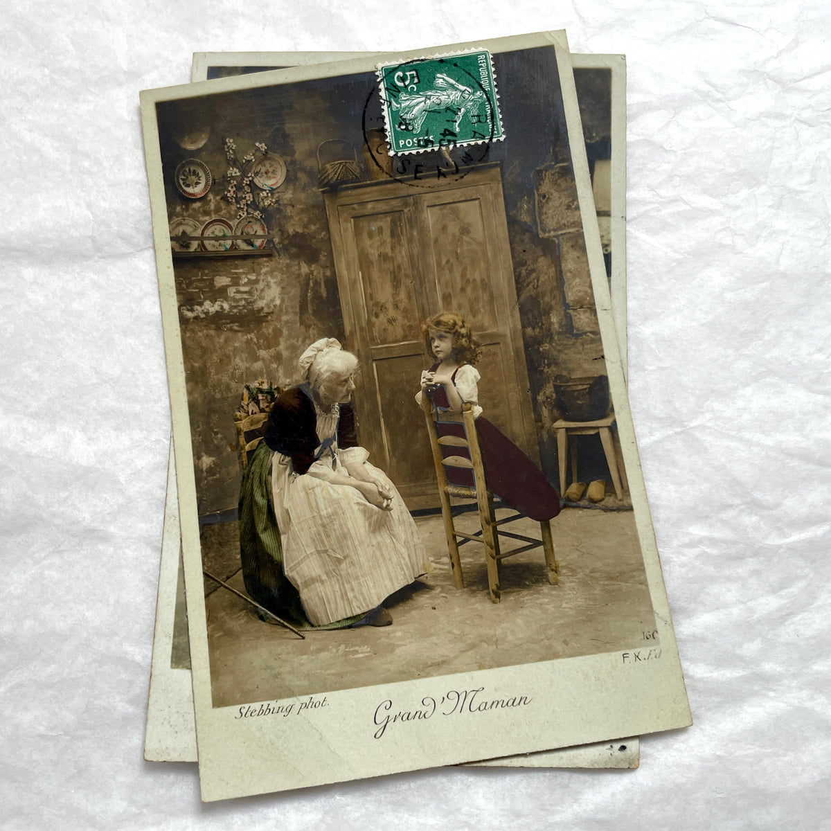 1910s French postcard lot of 5, featuring sepia-toned photos of a grandmother and granddaughter in daily scenes.