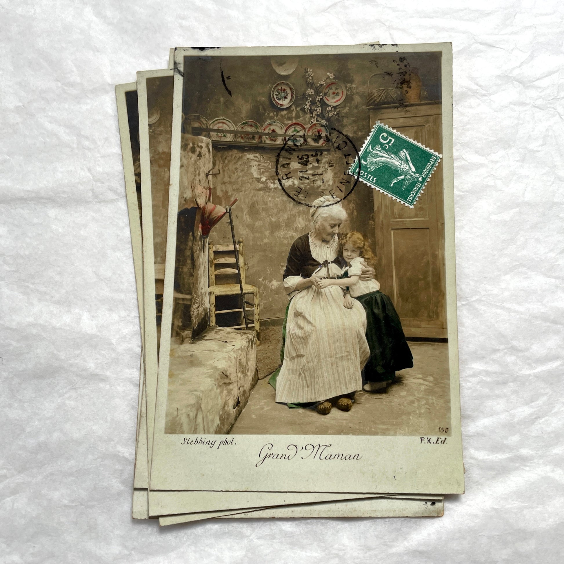 1910s French postcard lot of 5, featuring sepia-toned photos of a grandmother and granddaughter in daily scenes.
