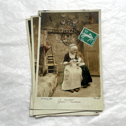 1910s French postcard lot of 5, featuring sepia-toned photos of a grandmother and granddaughter in daily scenes.