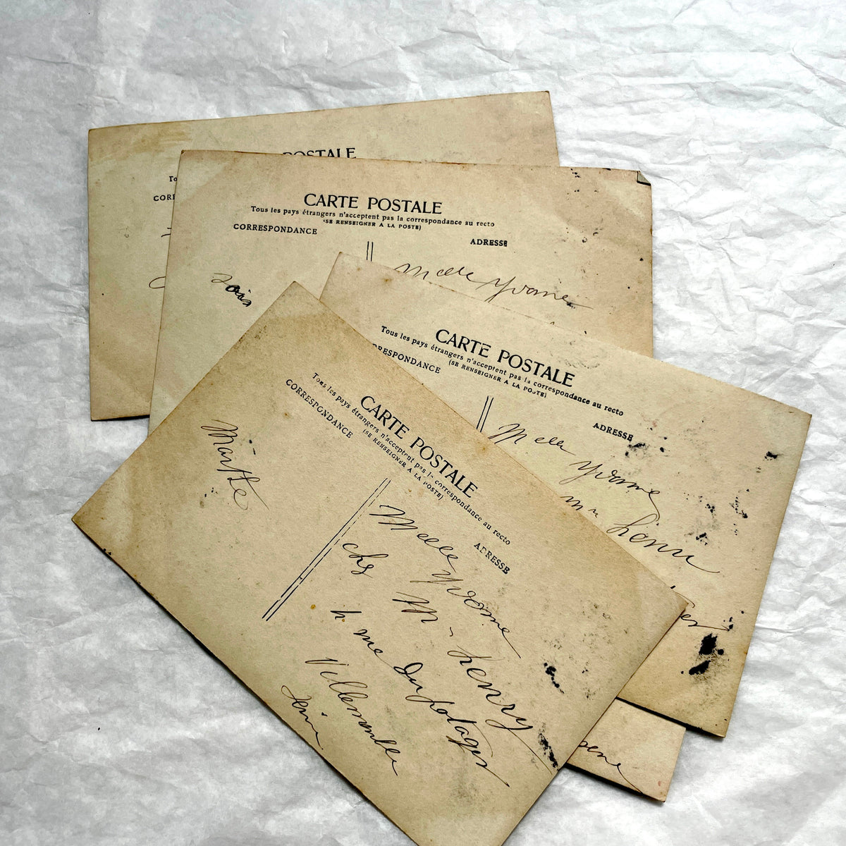 1910s French postcard lot of 5, featuring sepia-toned photos of a grandmother and granddaughter in daily scenes.