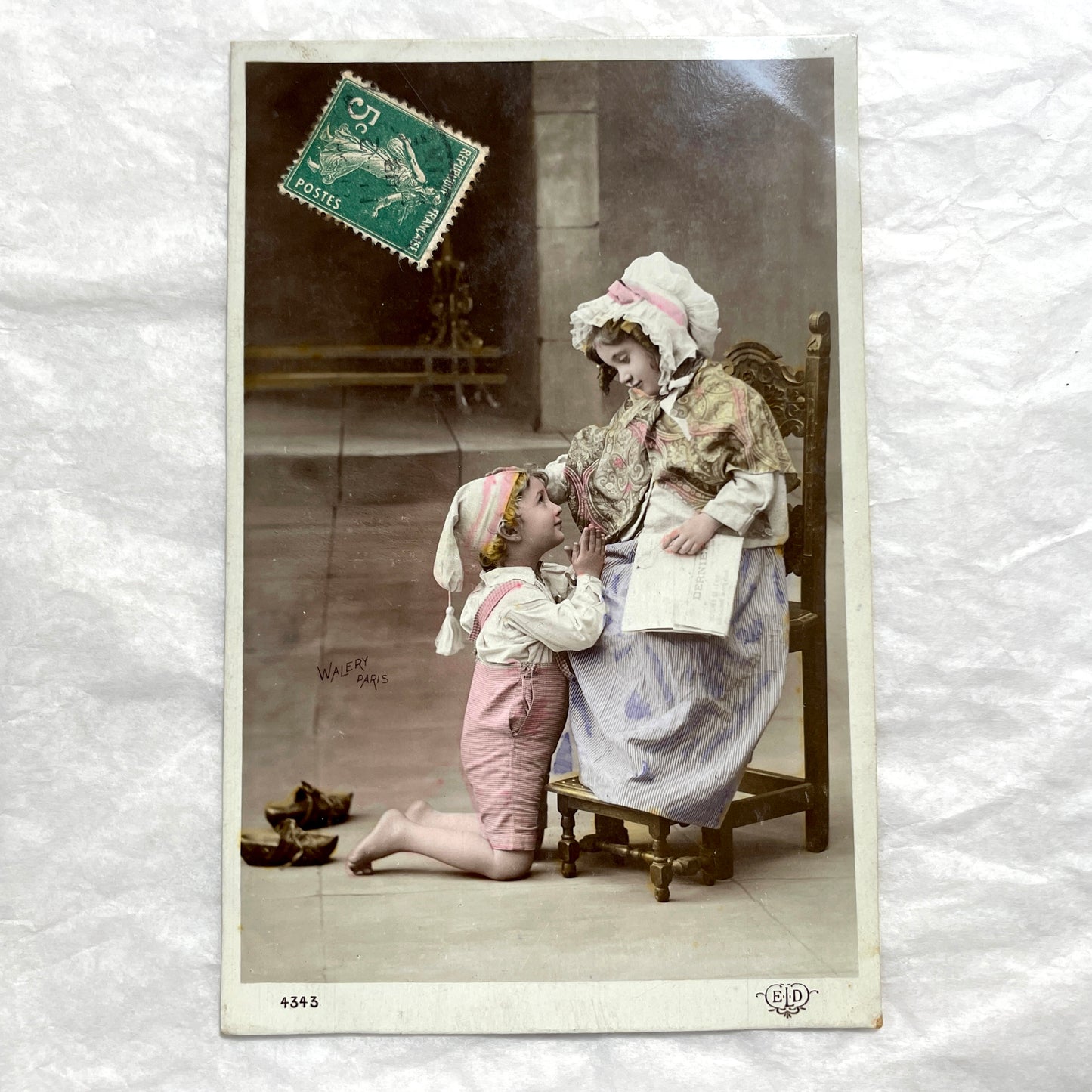 1900s French Postcards Lot - Hand-colored images of children with bonnets and newspaper by Walery Paris.
