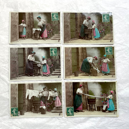 Lot of 6 1910s French postcards depicting women washing laundry in a village setting with visible French stamps.