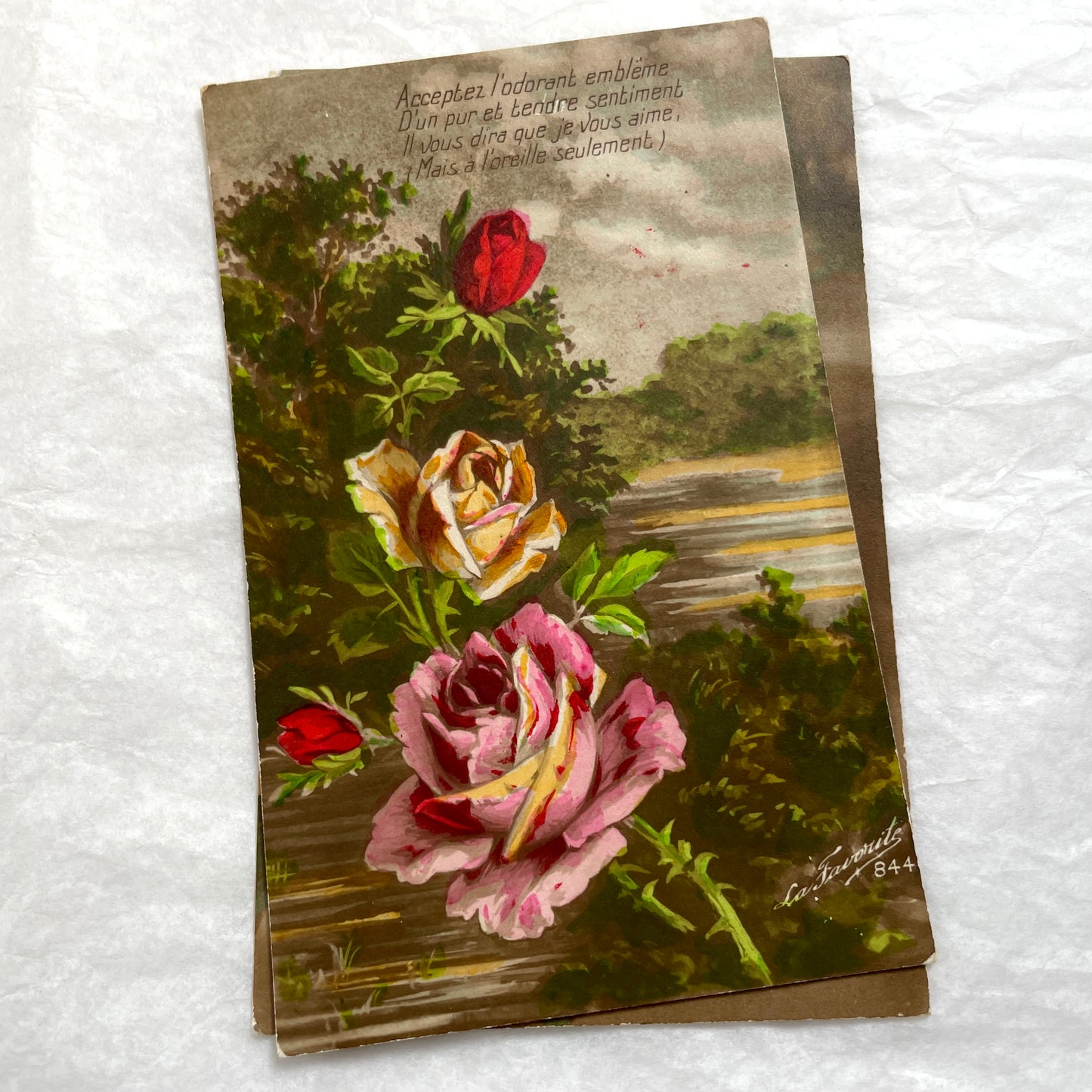 Lot of 1900s French postcards with vintage floral illustrations and romantic French messages.