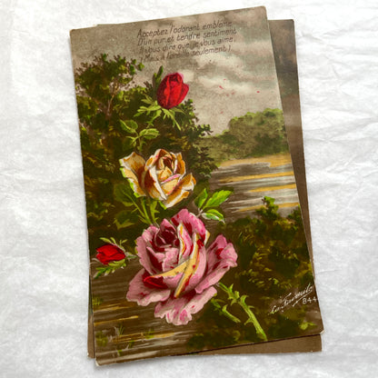 Lot of 1900s French postcards with vintage floral illustrations and romantic French messages.