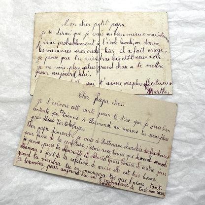 Lot of 1900s French postcards with vintage floral illustrations and romantic French messages.