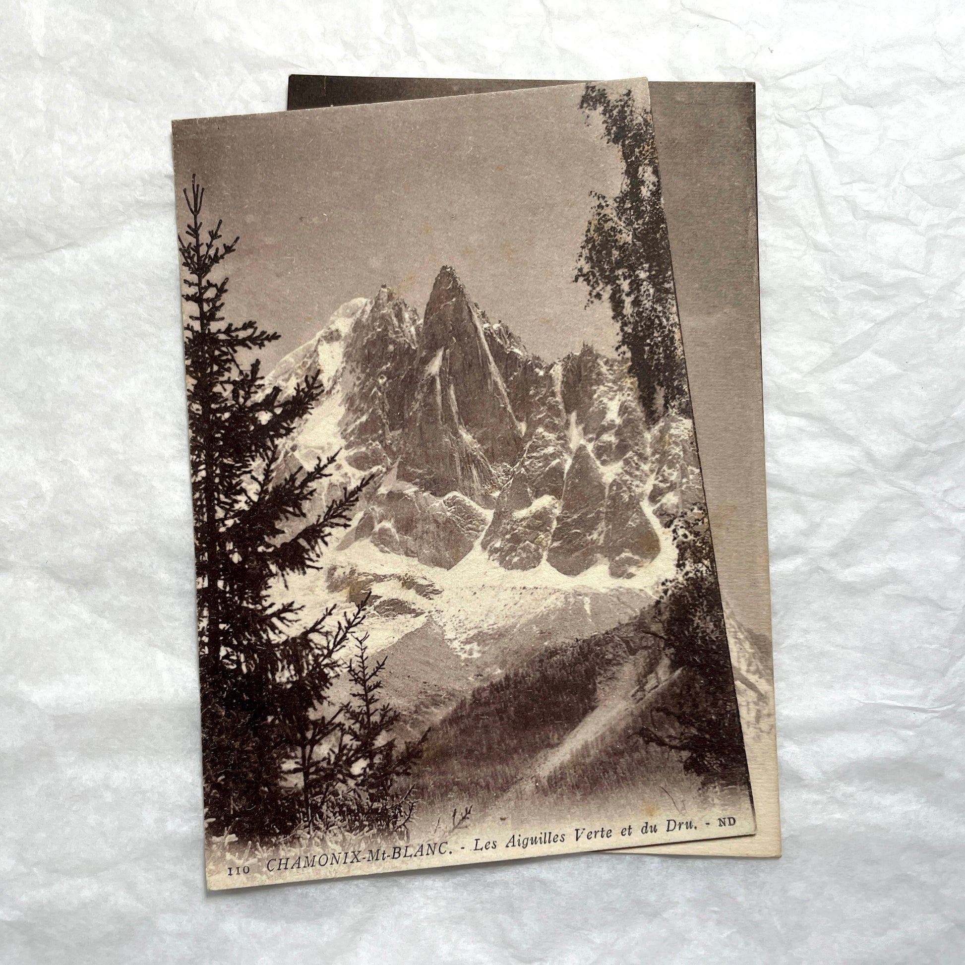 1910s French postcard lot of Chamonix-Mont-Blanc with mountaineers on snow and views of alpine peaks.