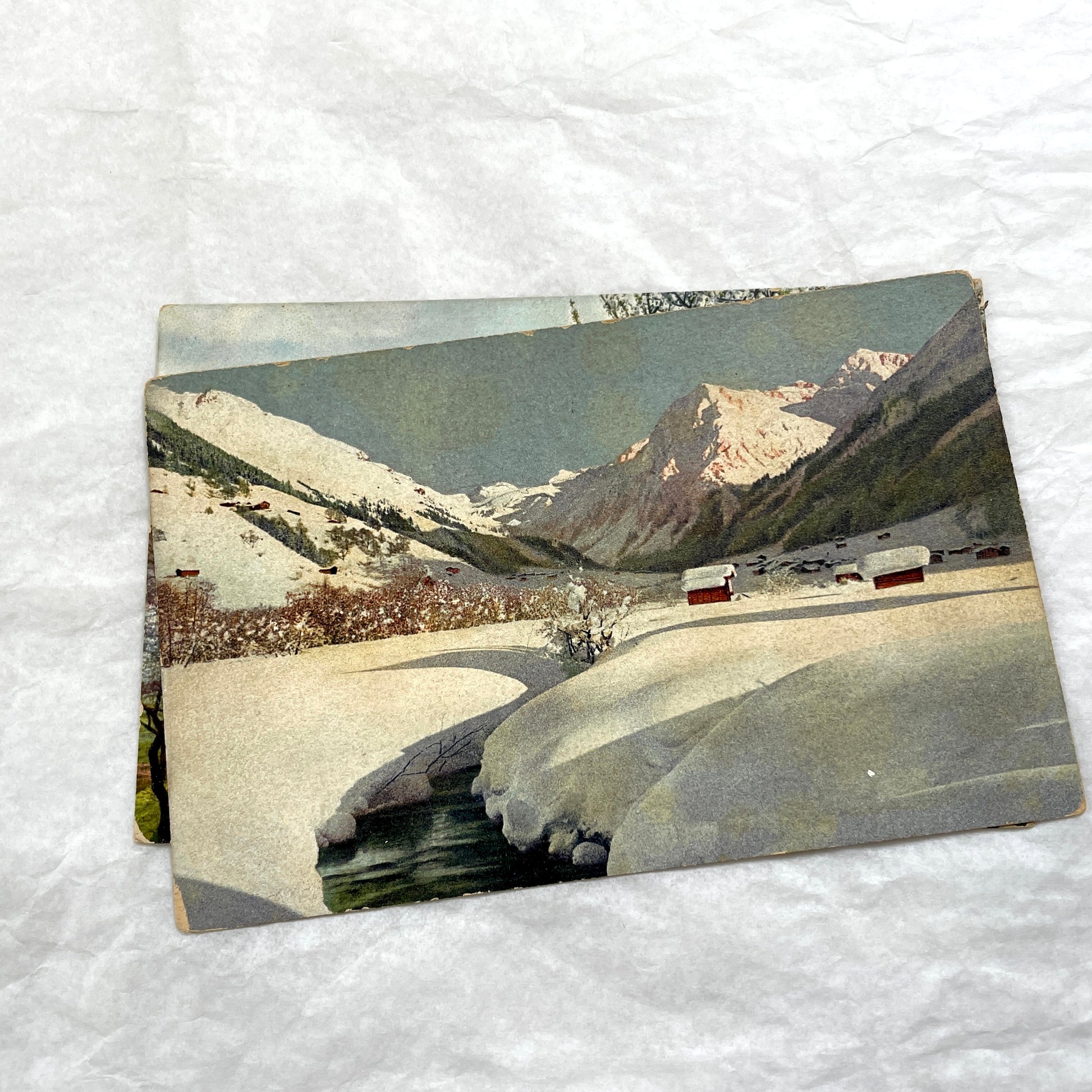 1900s Lot of Four Postcards - Diverse European Landscapes with Seasons, including a castle and snowy mountains.