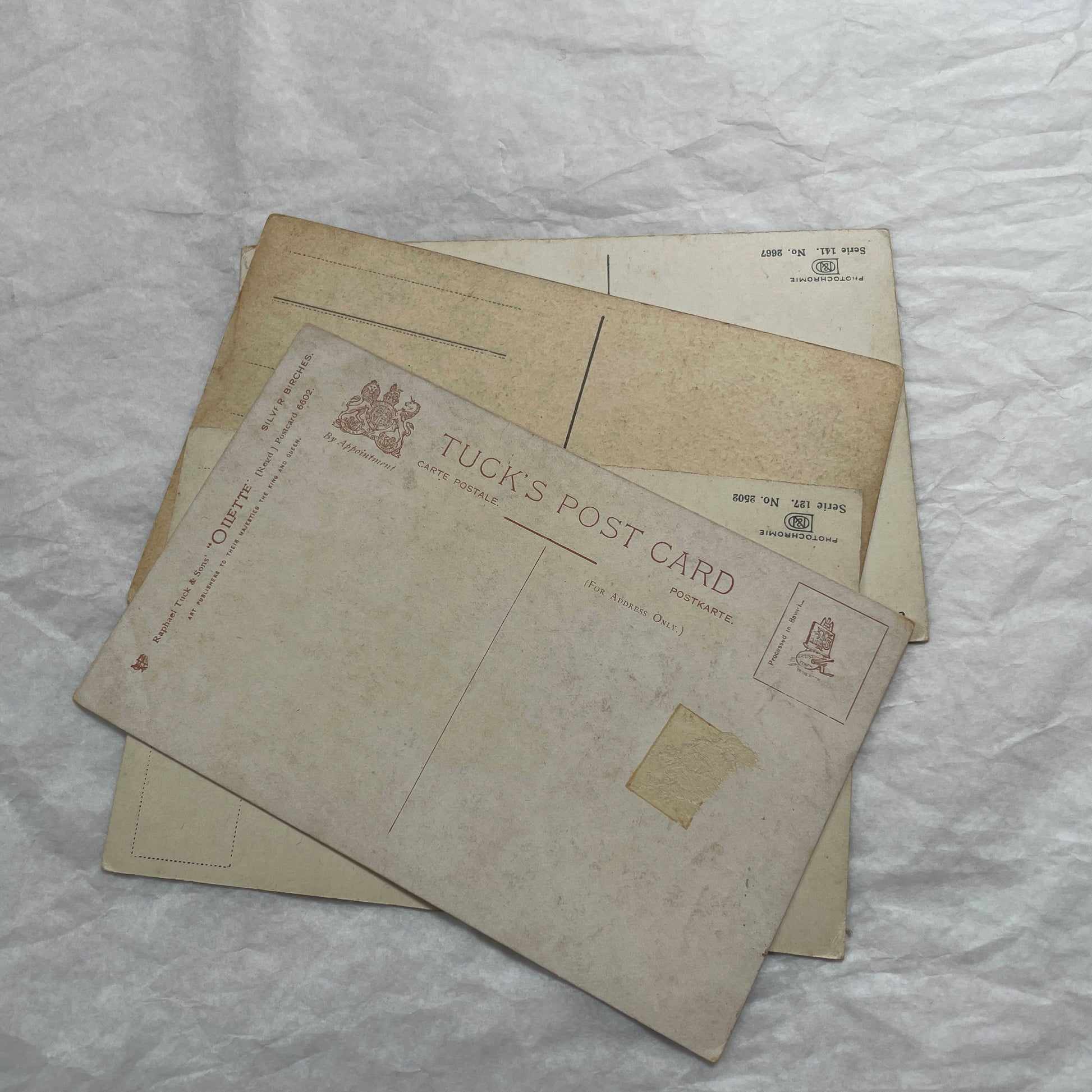 1900s Lot of Four Postcards - Diverse European Landscapes with Seasons, including a castle and snowy mountains.