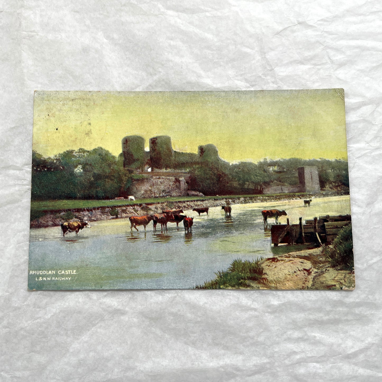 1910s postcard lot featuring European castles, a Swiss waterfall, and an English harbor scene with boats.