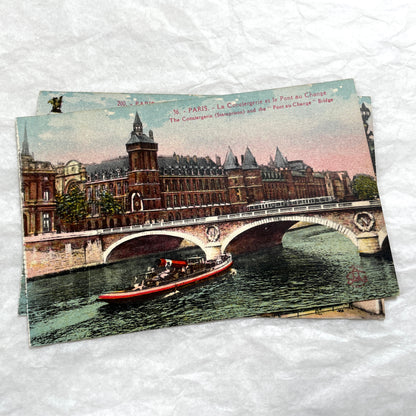 1900s vintage Paris postcards showing Pont Alexandre III and Conciergerie with boats on the Seine River.